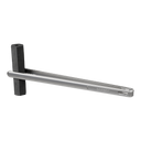Stainless steel Gozney fuel tongs gripping a rectangular piece of charcoal.