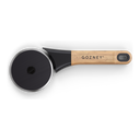 Gozney pizza cutter viewed from above, with a black circular wheel and branded wooden handle.