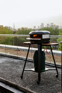 Gozney Arc Stand supporting an Off Black Gozney Arc XL on a rooftop terrace; oven sold separately