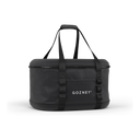 Black Gozney Tread Venture Bag viewed at a slight angle with raised carry handles and a white logo.